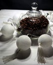 Coffee beans in a glass tea pot