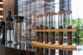 Coffee beans in glass tubes for Drip coffee on wood table at coffee shop.coffee beans in a test tube