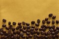 Coffee beans on golden background