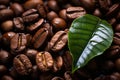 coffee beans with green leaf on black background Royalty Free Stock Photo