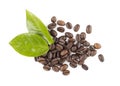 Coffee beans and green leaves on a white background