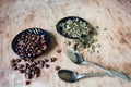 Coffee beans and green tea leaves Royalty Free Stock Photo