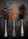 Coffee beans, ground coffee and instant coffee on spoons Royalty Free Stock Photo