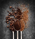 Coffee beans, ground coffee and instant coffee on spoons Royalty Free Stock Photo