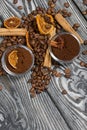 Coffee beans. Ground coffee in containers and spices. On a surface of brushed pine boards painted black and white Royalty Free Stock Photo