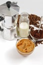 Coffee beans and ground, milk in a bottle, Moka pot Royalty Free Stock Photo