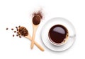 Coffee beans and ground coffee on wooden spoon with cup of black Royalty Free Stock Photo