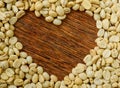 Coffee Beans Heart background , Dark wooden. Royalty Free Stock Photo