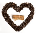 Coffee beans in heart shape and cinnamon in the center Royalty Free Stock Photo