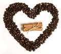 Coffee beans in heart shape and cinnamon in the center Royalty Free Stock Photo