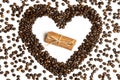 Coffee beans in heart shape and cinnamon in the center Royalty Free Stock Photo