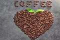 Coffee beans in heart shape on grey background .Coffee Beans Royalty Free Stock Photo