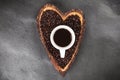 Coffee beans in a heart shaped bowl Royalty Free Stock Photo