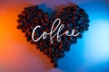 Coffee beans are highlighted with neon lined in the shape of a heart