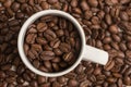 coffee beans inside and outside a cup Royalty Free Stock Photo