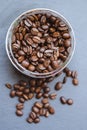 Coffee beans in a jar on a dark background, close-up