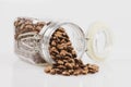 Coffee beans in a jar on white