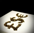 Coffee beans in money shapes Royalty Free Stock Photo