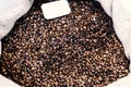 Coffee beans in open burlap bag. Food ingredients. Top view. Close-up Royalty Free Stock Photo