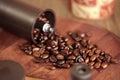 Coffee beans overflowing from the coffee mill Royalty Free Stock Photo