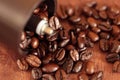 Coffee beans overflowing from the coffee mill Royalty Free Stock Photo