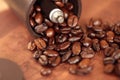 Coffee beans overflowing from the coffee mill Royalty Free Stock Photo