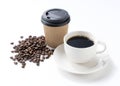 Coffee and coffee beans and paper cups on a white background