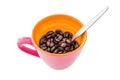 Coffee beans in pink cup