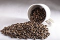 Coffee Beans Pouring Out of Cup Royalty Free Stock Photo