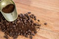 Coffee beans with powder and scoop Royalty Free Stock Photo
