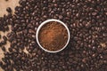 Coffee beans and powder with textured background stock image.