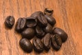 Coffee beans on red wood Royalty Free Stock Photo