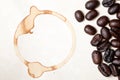 Coffee beans and ring stain Royalty Free Stock Photo