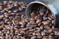 Coffee beans roasted isolated on wooden background close up cut out in cup Royalty Free Stock Photo