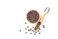 Coffee beans roasted in a wooden bowl and beans scoop on a white background. Top view Royalty Free Stock Photo