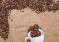 Coffee beans on sackcloth white cup Royalty Free Stock Photo