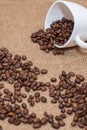 Coffee beans on sackcloth white cup Royalty Free Stock Photo