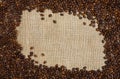 Coffee beans on sacking background Royalty Free Stock Photo