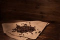 Coffee beans on sacking on the wooden background Royalty Free Stock Photo