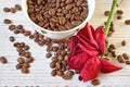 Coffee beans are scattered on the table. Dried rose on the table. Royalty Free Stock Photo