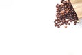 Coffee beans are scattered on a white background. Royalty Free Stock Photo