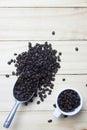 Coffee beans in scoop on wood background Royalty Free Stock Photo