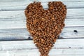 coffee beans, seeds of the Coffea plant and the source for coffee. coffee beans in a heart shaped formation, caffeine lover and