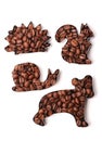 Coffee beans in the shape of animals on a white background Royalty Free Stock Photo