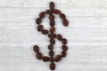 Coffee beans in a shape of Dollar sign Royalty Free Stock Photo