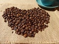 Coffee beans in shape of heart on a background of burlap Royalty Free Stock Photo