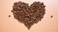 Coffee beans in the shape of a heart on a beige background Royalty Free Stock Photo