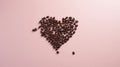 Coffee beans in the shape of a heart on a pink background Royalty Free Stock Photo