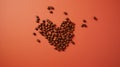 Coffee beans in the shape of a heart on a red background Royalty Free Stock Photo