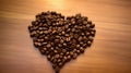 Coffee beans in the shape of a heart on a wooden background Royalty Free Stock Photo